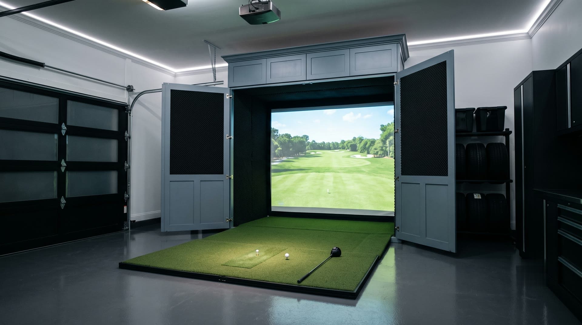 Murphy golf simulator fully deployed in an upscale garage, cabinet doors open with fold-down turf platform